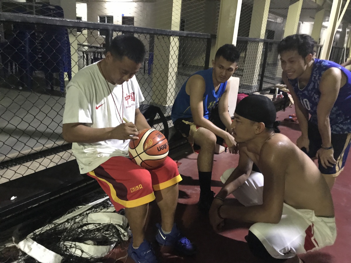 Sun Wei, a volunteer from Shanghai, worked as a basketball coach in Laos for seven months in 2017. CHINA DAILY